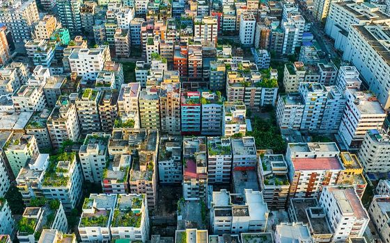 Aerial view of apartment buildings across a dense Dhaka neighbourhood